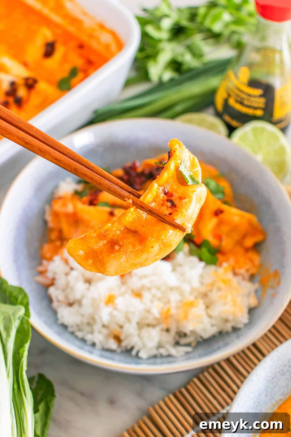 Delicious baked dumplings topped generously with chili crisp, creating a mouth-watering visual.