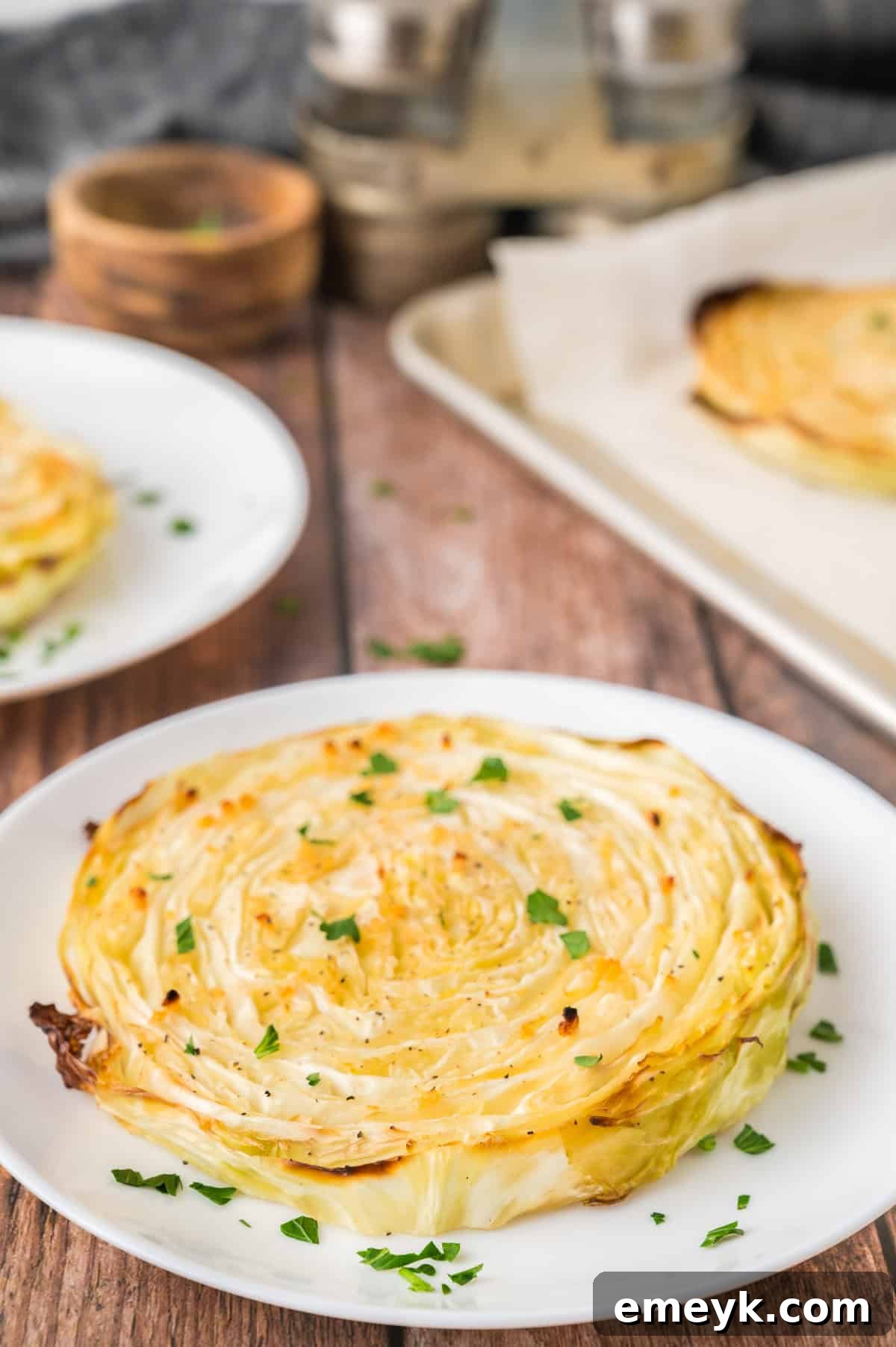 Crispy Roasted Cabbage Steaks on a white plate ready to be enjoyed