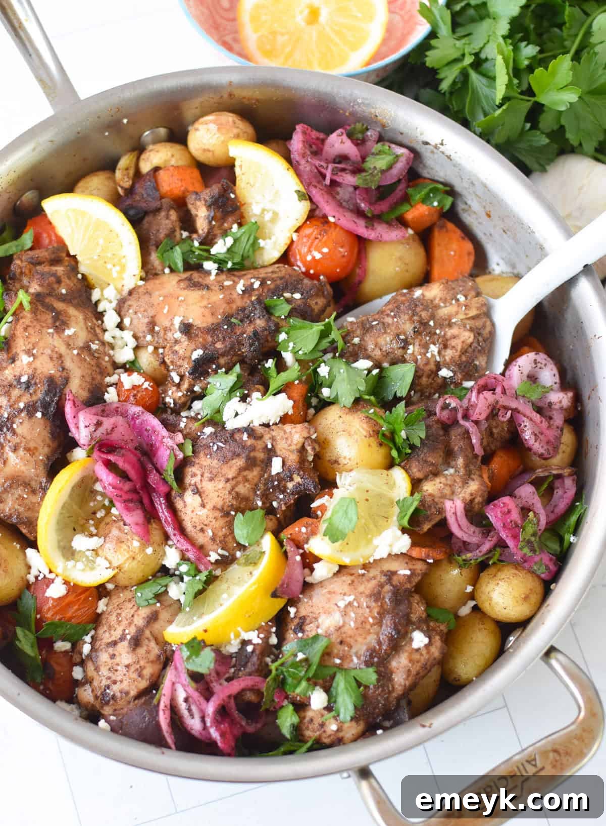 Lebanese 7 spice chicken with roasted vegetables on a sheet pan