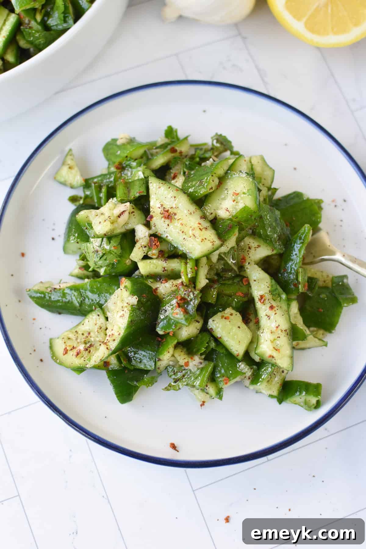 Tangy Smashed Cucumber Salad with Sumac and Lemon Dressing, vibrant and fresh.