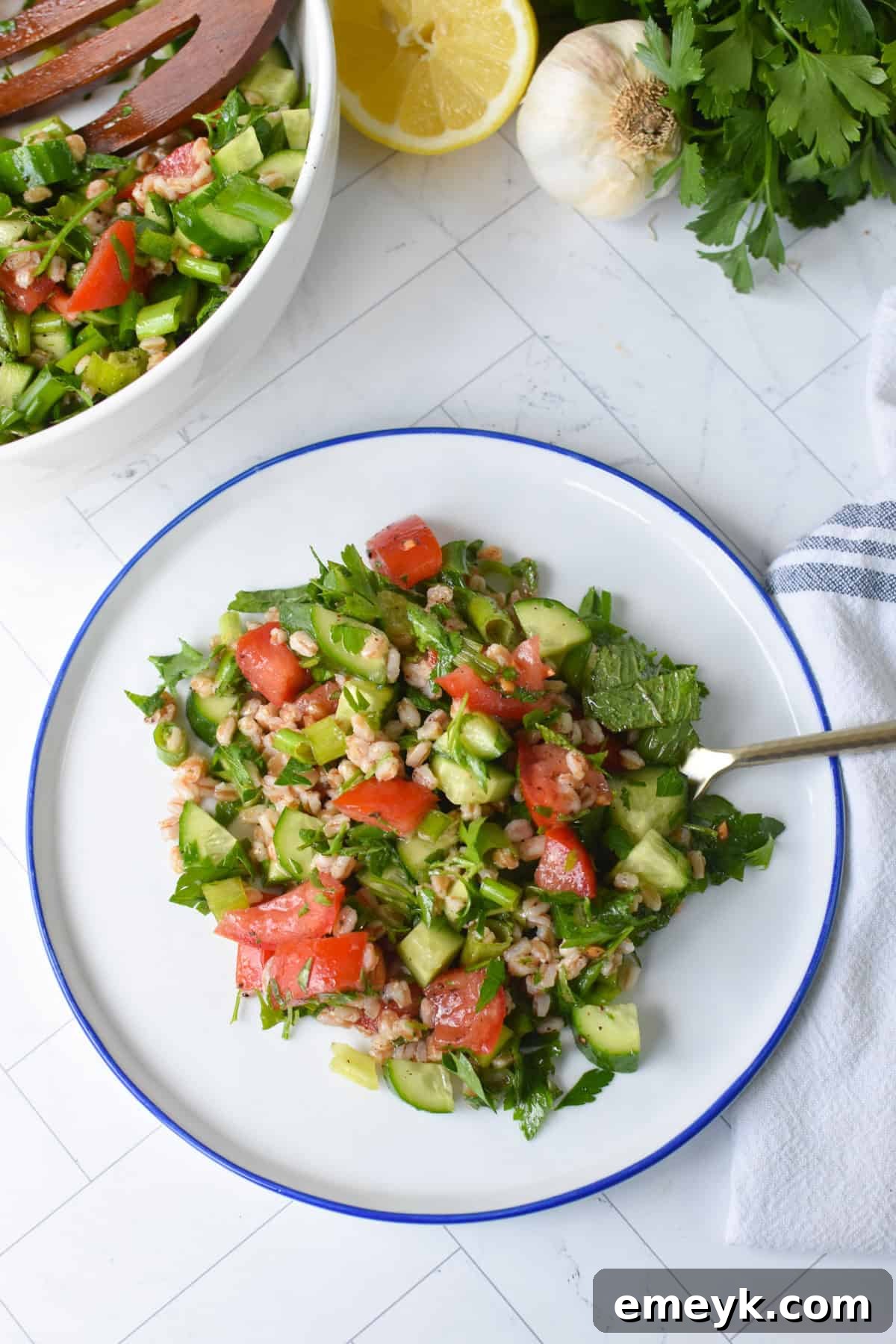 Mediterranean Farro Tabbouleh 8 Individual serving of Farro Tabbouleh on a small white plate, ready to be enjoyed.