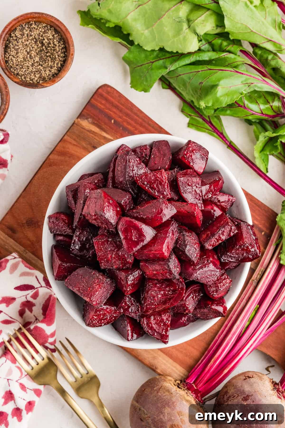 Quick and Easy Foil Free Roasted Beets 5 A close-up of fork-tender oven-roasted beets in a shallow bowl, drizzled with olive oil.