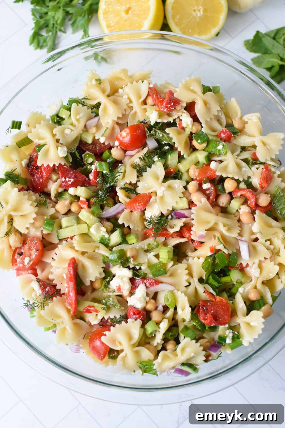 Easy Mediterranean Bowtie Pasta Salad in a glass bowl