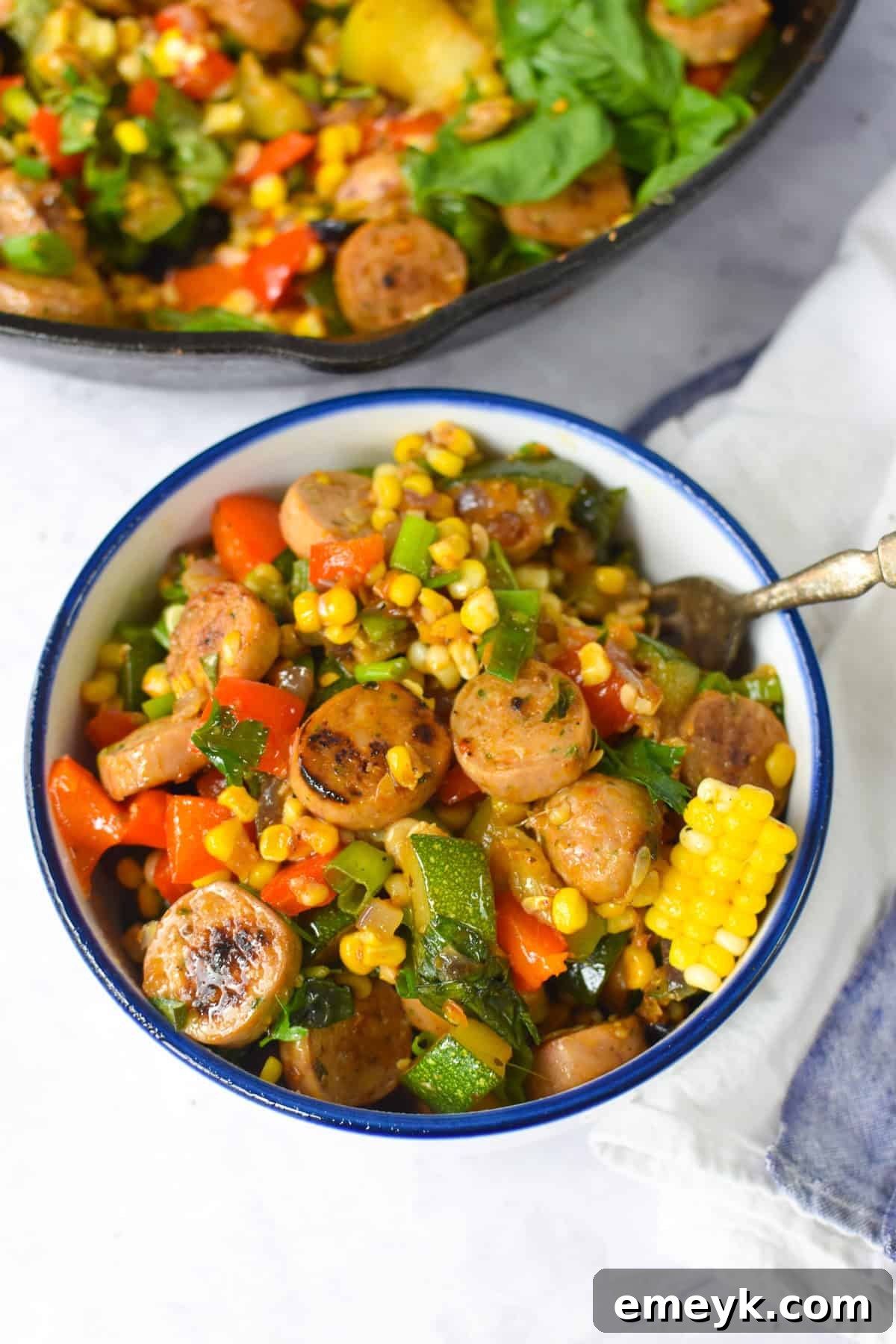 Sausage Veggie Skillet in a white and blue bowl 