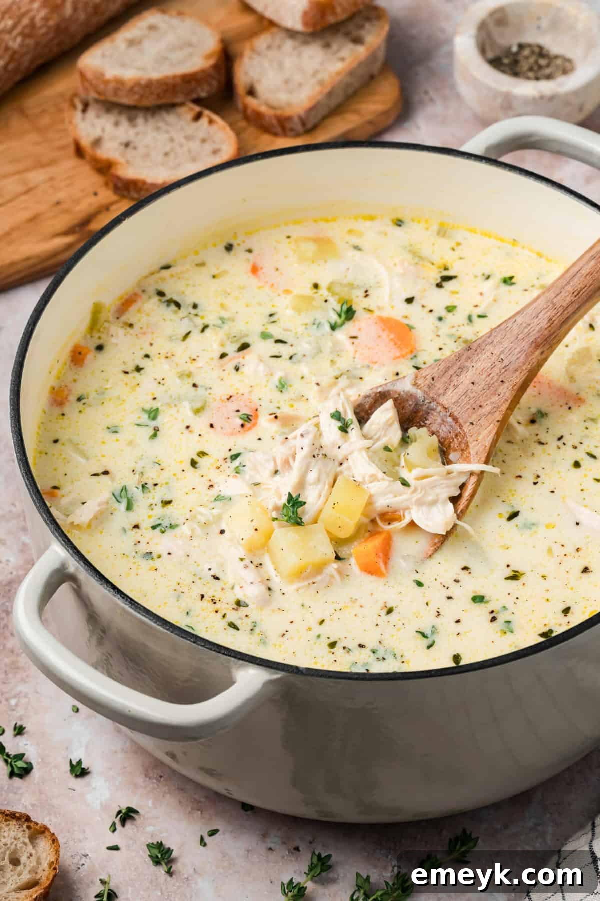 Easy Chicken Potato Soup with a spoon showing chicken 