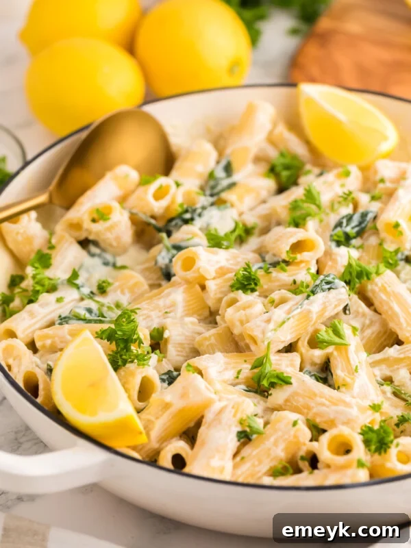 Lemon Ricotta Pasta in a pot with a gold serving spoon.