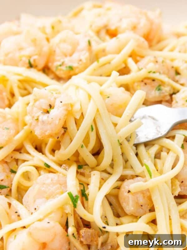 Lemon Garlic Shrimp Pasta in a bowl with a fork