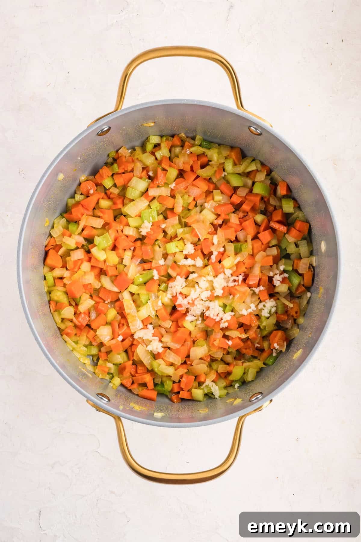 Sauteed vegetable in a pot for Chicken Pastina Soup 